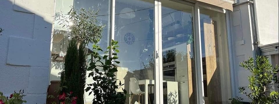 Calibaie - Agrandissement d'une maison avec un coulissant